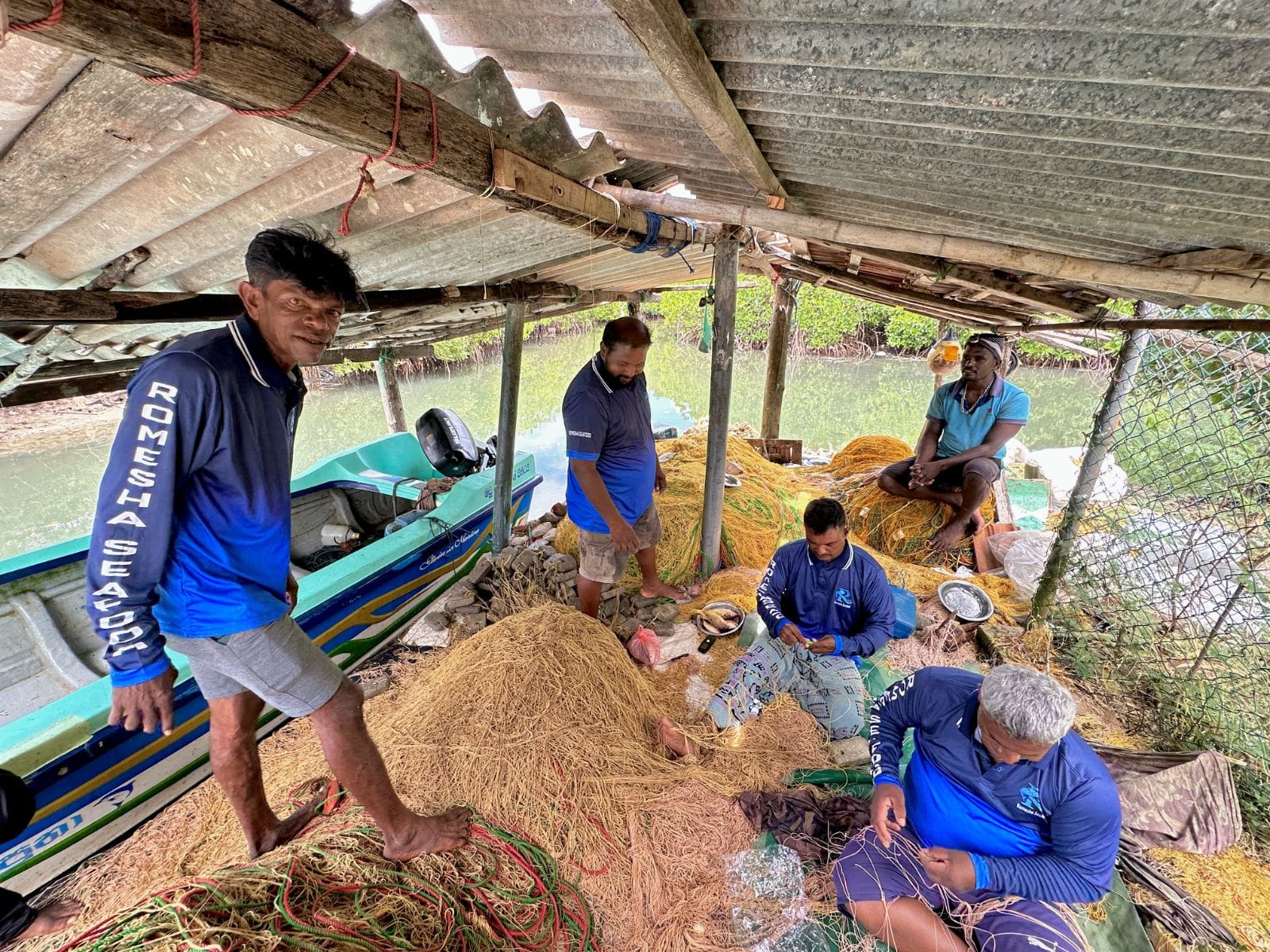 Team handling nets on water
